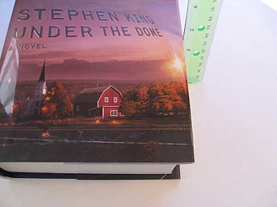 underthedome It weighs 4 lbs and with the covers is 2.5 inches thick. Yes, it would break your nose if it fell on your face in bed.